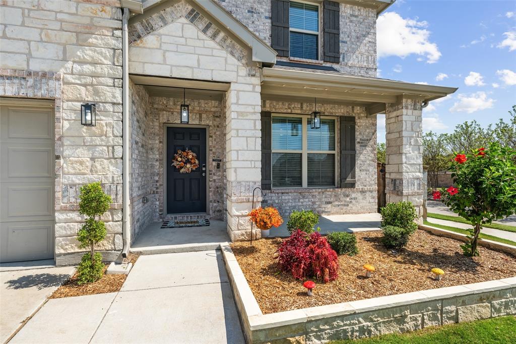 11852 Toppell Trail Fort Worth, TX 76052 - Photo 2 of 32 a front view of a house with fountain