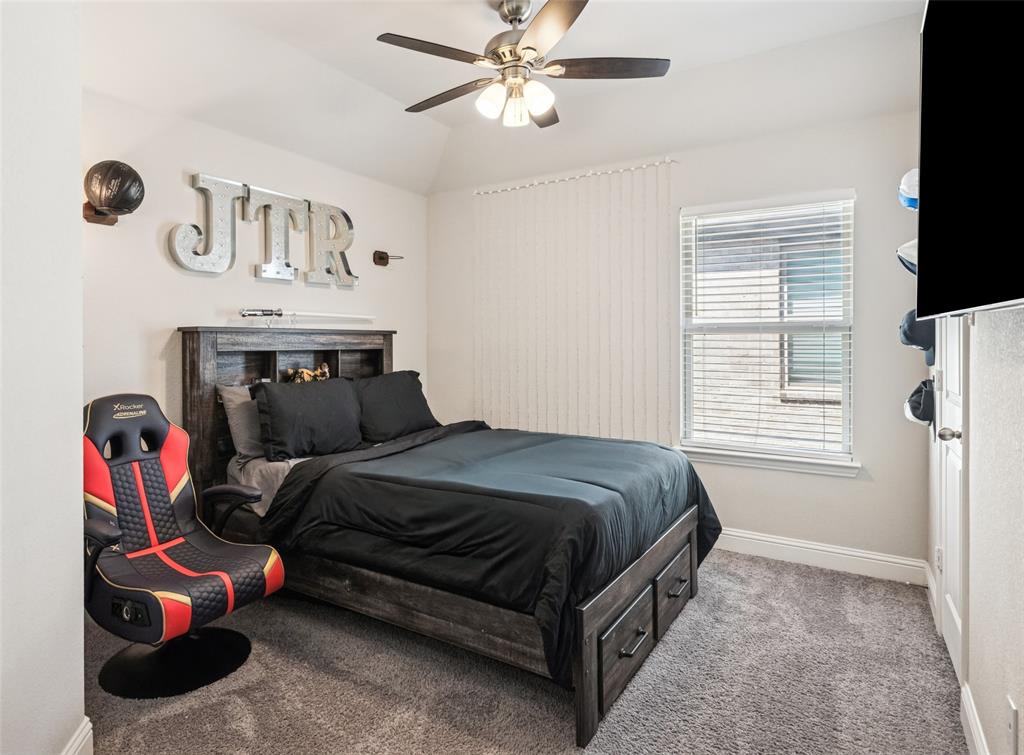 11852 Toppell Trail Fort Worth, TX 76052 - Photo 25 of 32 a bedroom with a bed and a window