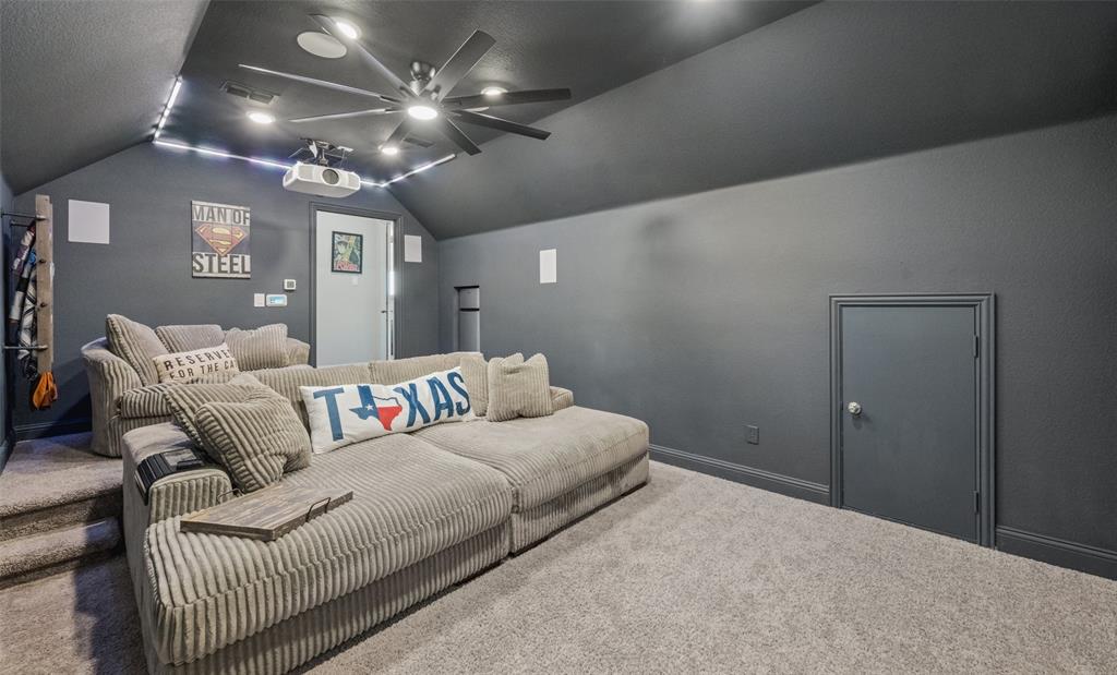 11852 Toppell Trail Fort Worth, TX 76052 - Photo 28 of 32 a bedroom with a large bed chandelier and a window