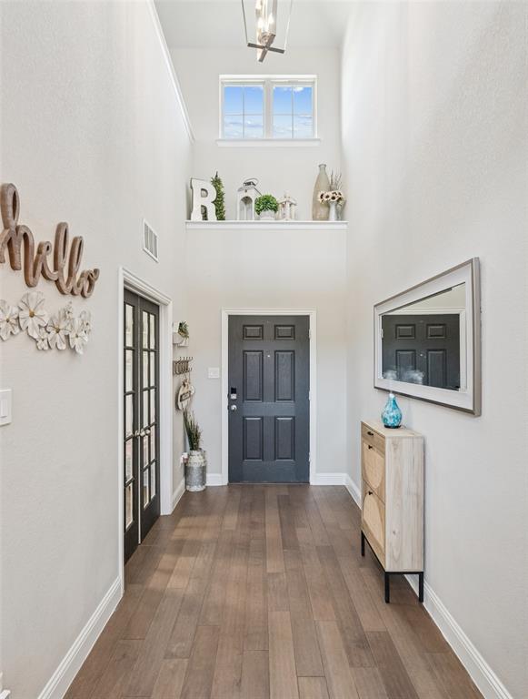11852 Toppell Trail Fort Worth, TX 76052 - Photo 3 of 32 a view of an empty room with a window