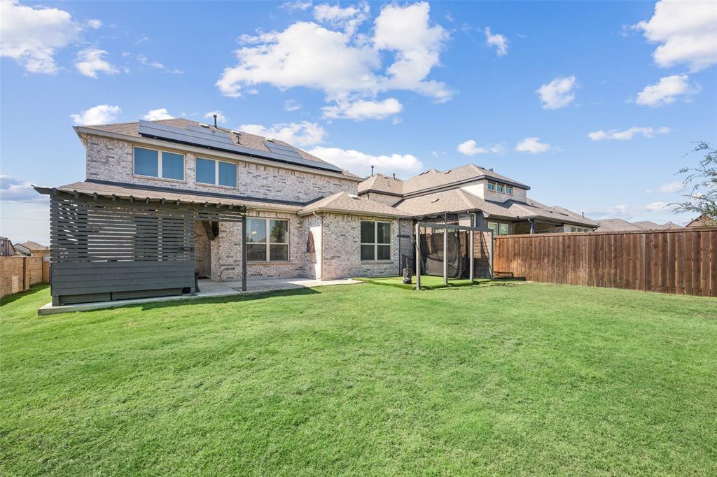 11852 Toppell Trail Fort Worth, TX 76052 - Photo 31 of 32 a view of a yard in front of a house with large tree