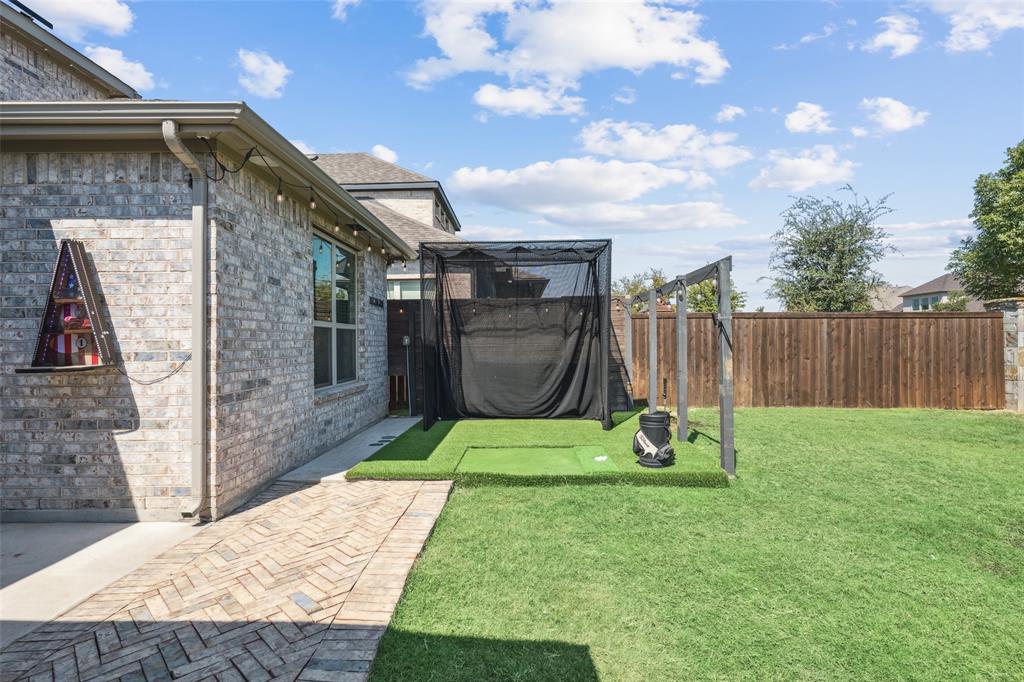 11852 Toppell Trail Fort Worth, TX 76052 - Photo 32 of 32 a backyard of a house with trampoline