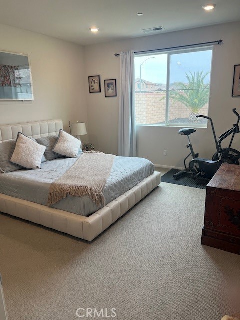 29901 Bridlegate Way Menifee, CA 92584 - Photo 14 of 43 a bedroom with a bed and glass window