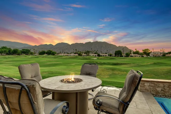 a view of a patio with garden