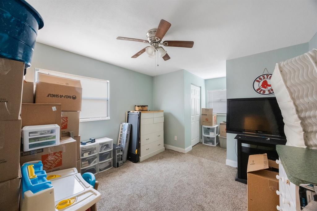 3336 20th Avenue Southwest Largo, FL 33774 - Photo 24 of 37 a view of workspace with furniture and a ceiling fan