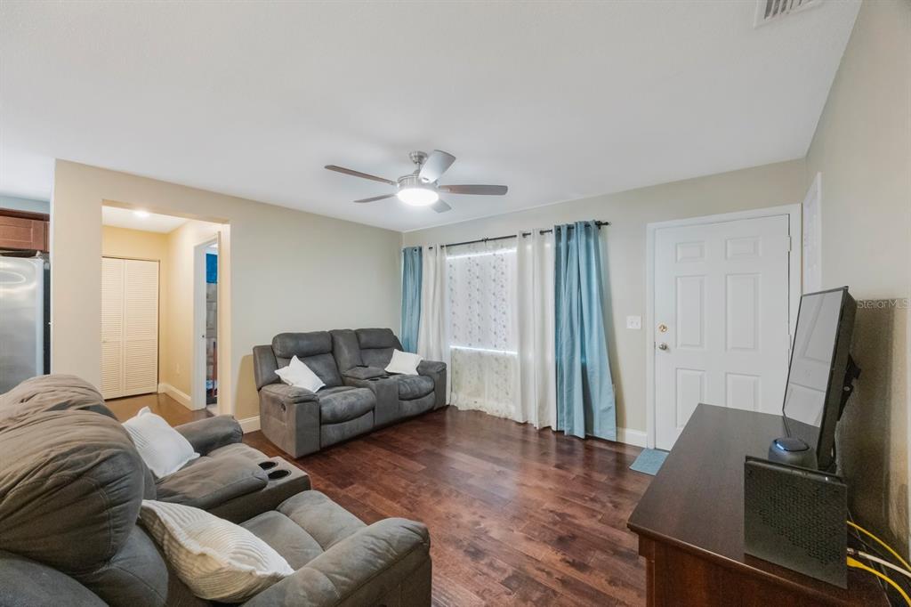 3336 20th Avenue Southwest Largo, FL 33774 - Photo 4 of 37 a living room with furniture and a flat screen tv