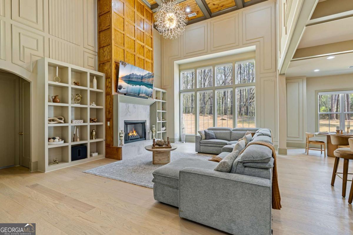 1315 Sandy Creek Road Tyrone, GA 30290 - Photo 20 of 100 a living room with furniture and a fireplace
