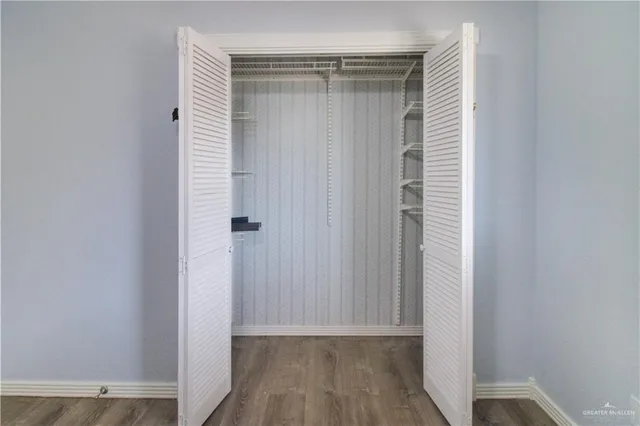 a view of a small space with wooden floor