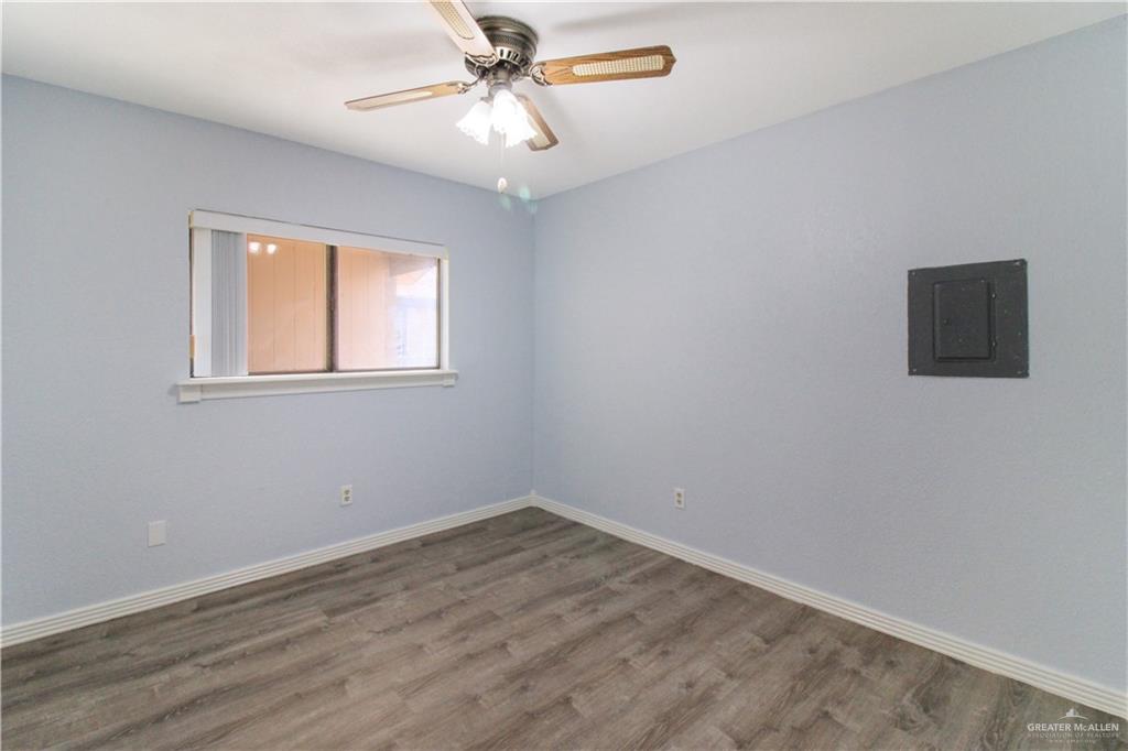 2921 Yuma Avenue McAllen, TX 78503 - Photo 8 of 10 a view of empty room with wooden floor and fan
