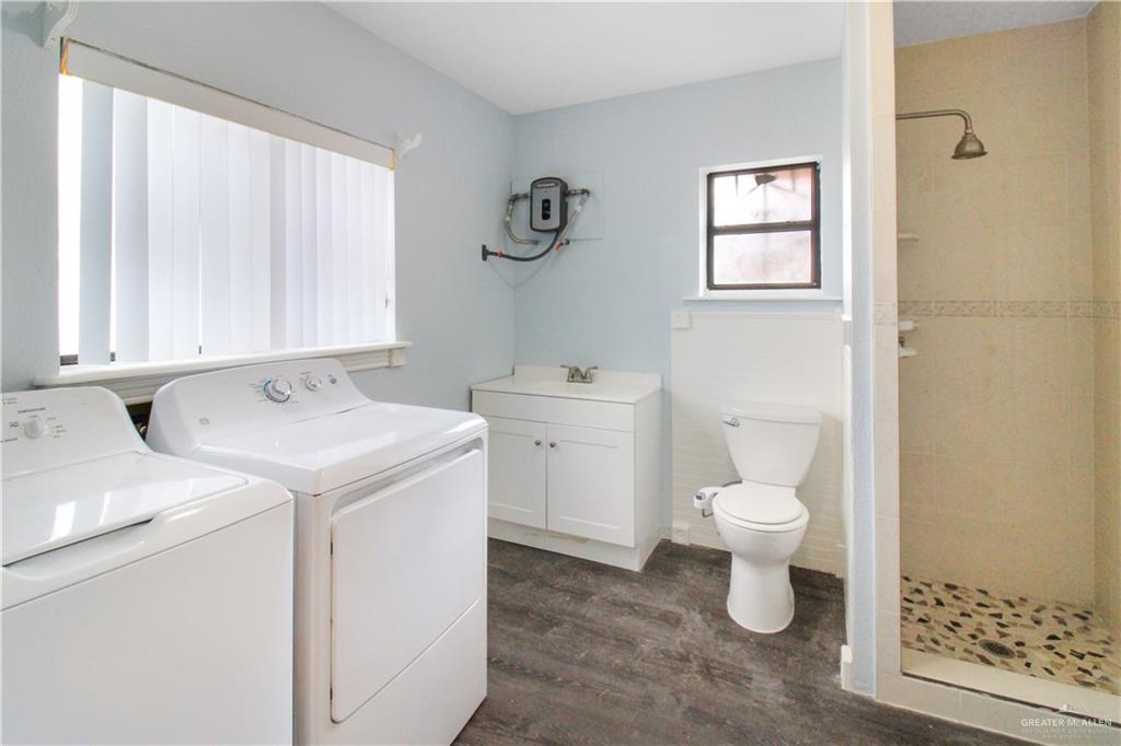 2921 Yuma Avenue McAllen, TX 78503 - Photo 10 of 10 a view of bathroom with a sink toilet and a window