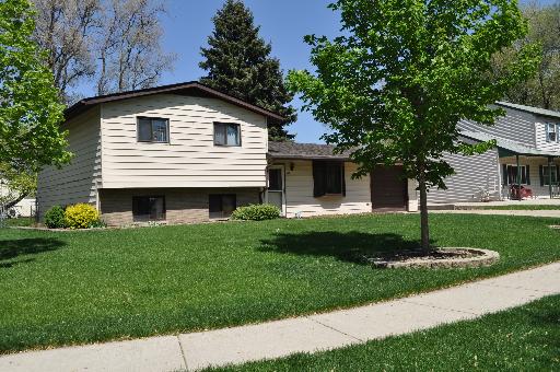 516 Spruce Road Bolingbrook, IL 60440 - Photo 1 of 16 a front view of a house with a yard and trees