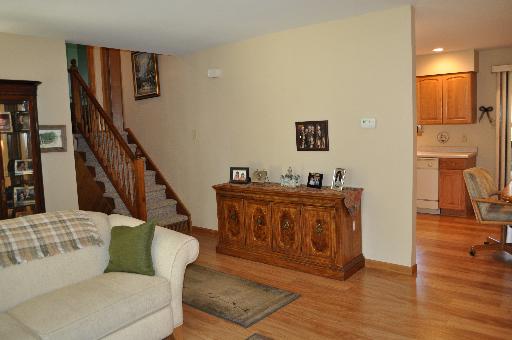 516 Spruce Road Bolingbrook, IL 60440 - Photo 3 of 16 a living room with furniture and a wooden floor