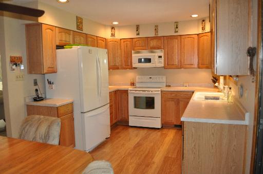 516 Spruce Road Bolingbrook, IL 60440 - Photo 5 of 16 a kitchen with stainless steel appliances a refrigerator and a sink