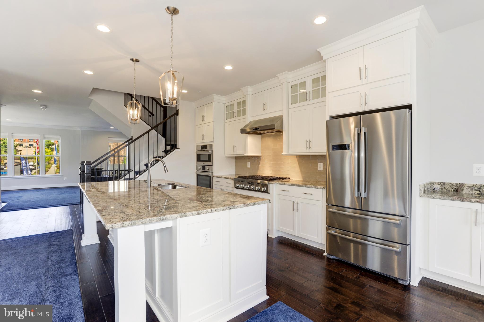 1973 Roland Clarke Place Reston, VA 20191 - Photo 14 of 38 Kitchen - Island with Bar Seating