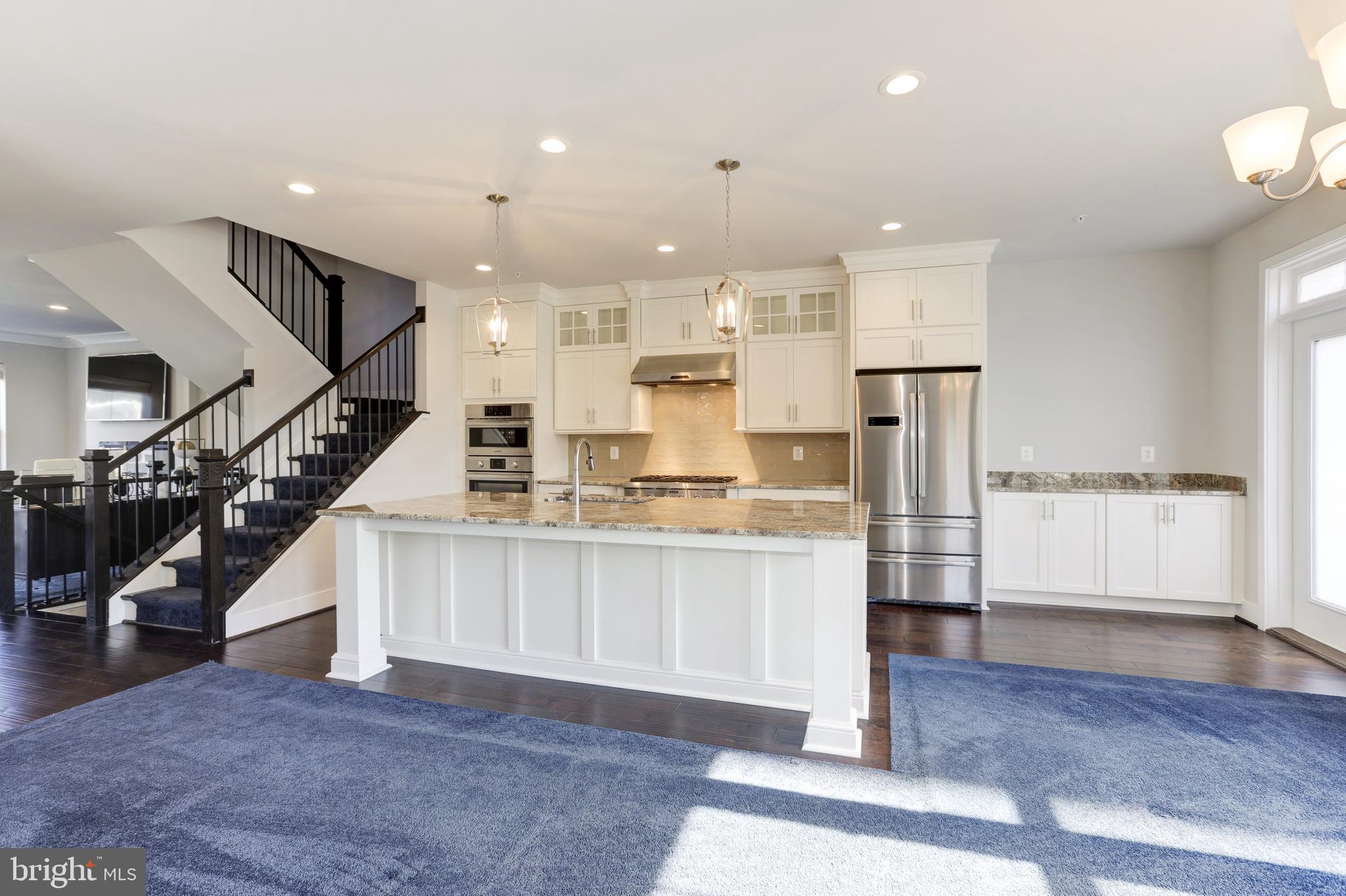 1973 Roland Clarke Place Reston, VA 20191 - Photo 9 of 38 Family Room open to Kitchen