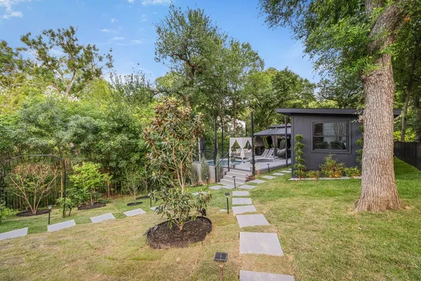 a view of a swimming pool with a patio
