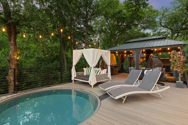 a view of house with backyard outdoor seating and green space