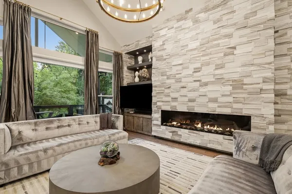 a living room with furniture and a large window