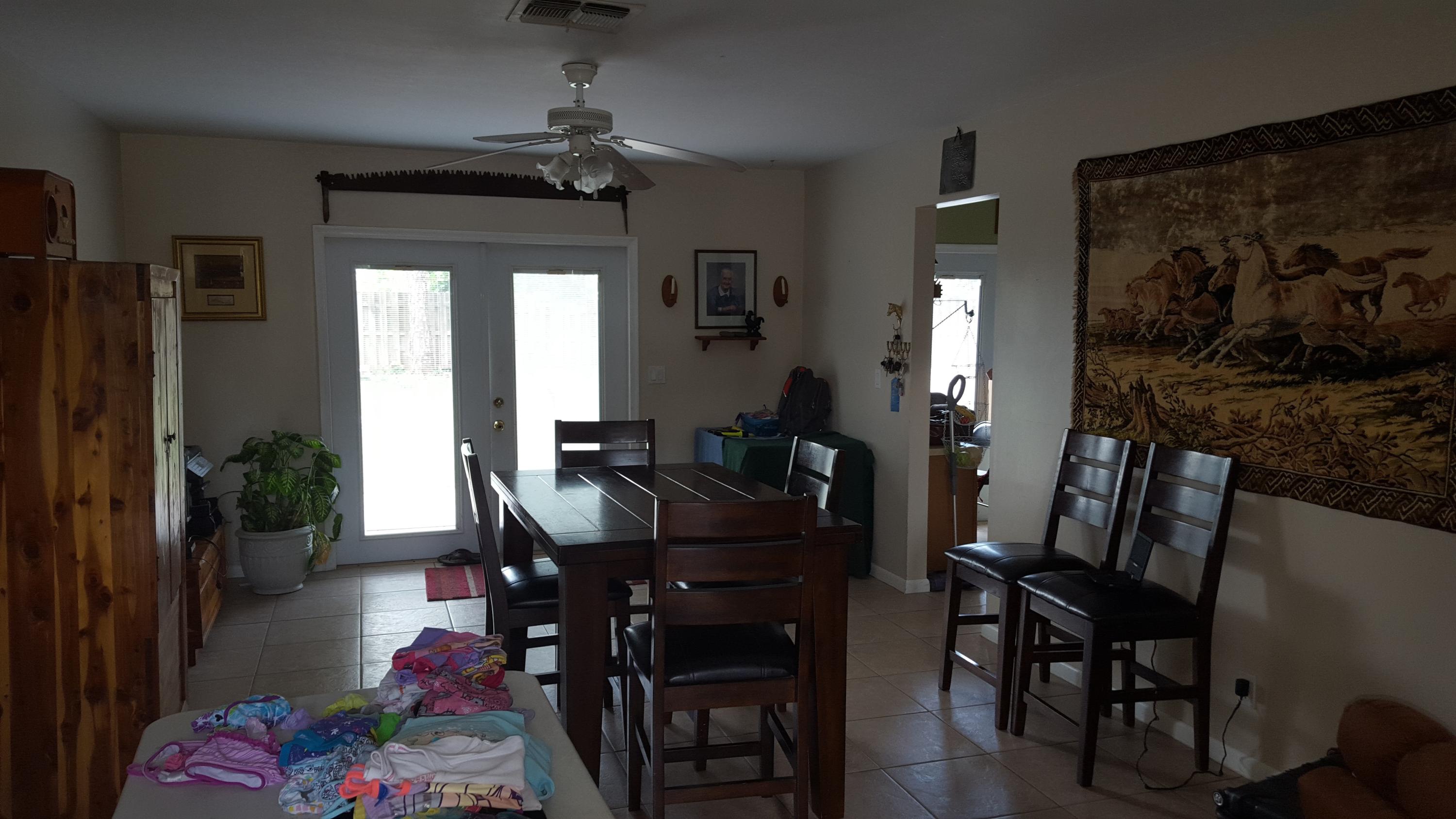 6459 Bischoff Road West Palm Beach, FL 33413 - Photo 11 of 12 a view of a dining room with furniture and wooden floor