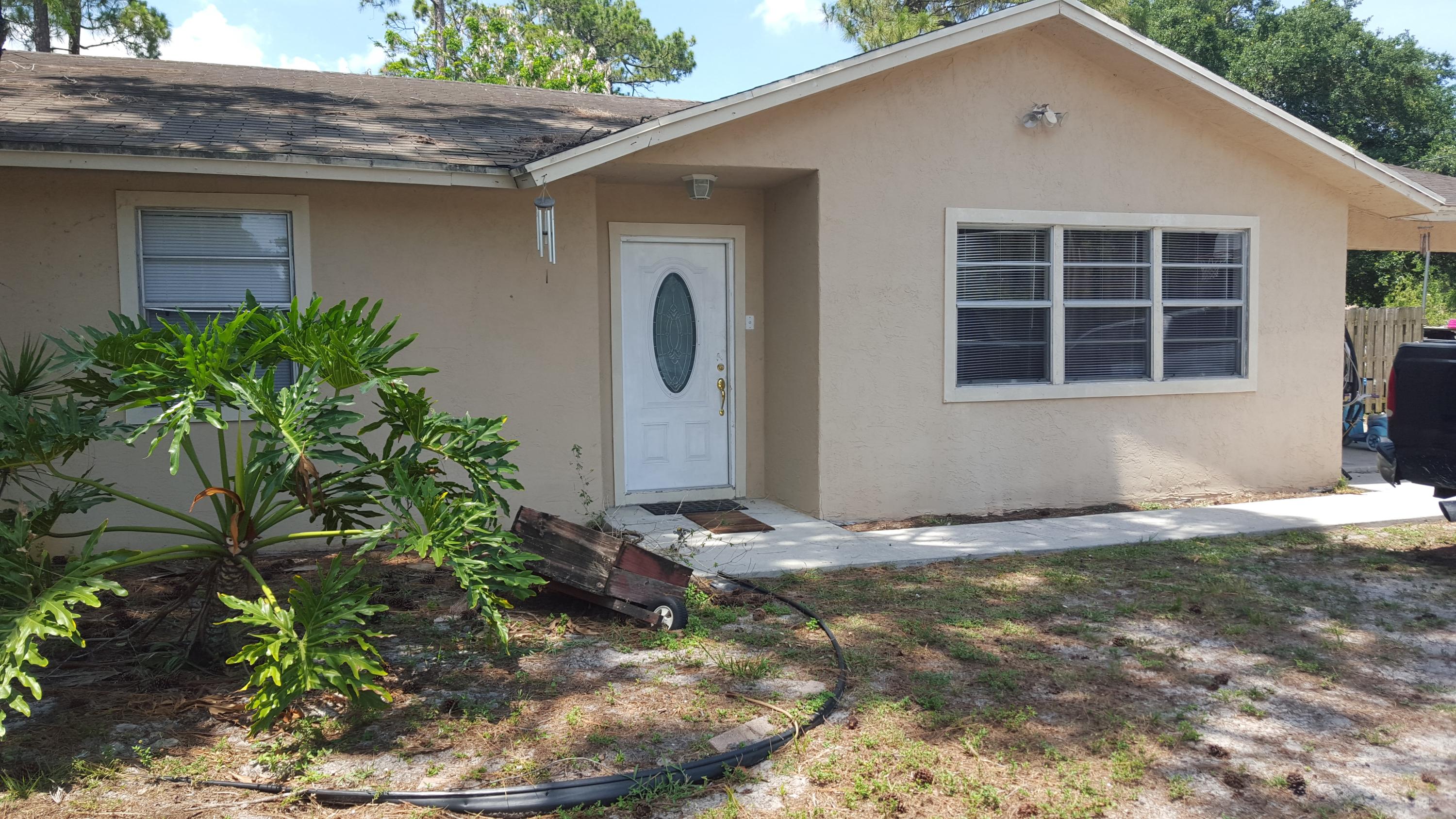 6459 Bischoff Road West Palm Beach, FL 33413 - Photo 10 of 12 a backyard of a house