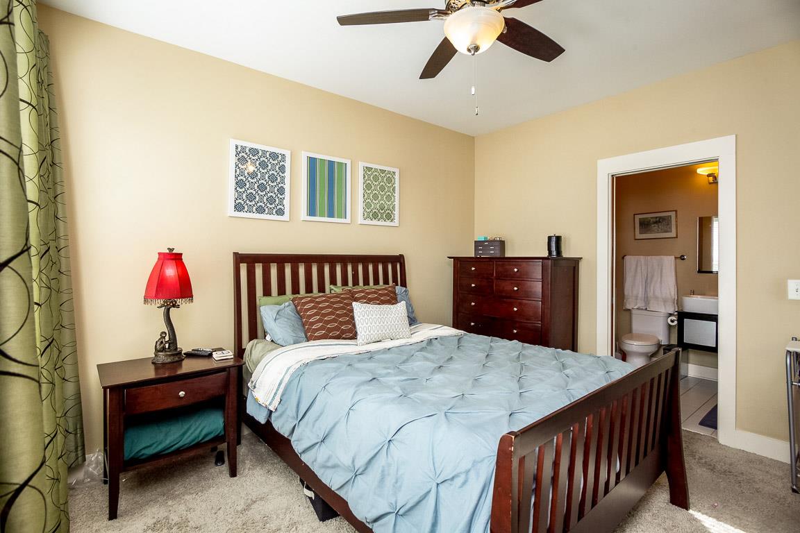 508 Madison Street, Unit 2 Nashville, TN 37208 - Photo 14 of 25 a bed room with a bed and a dresser