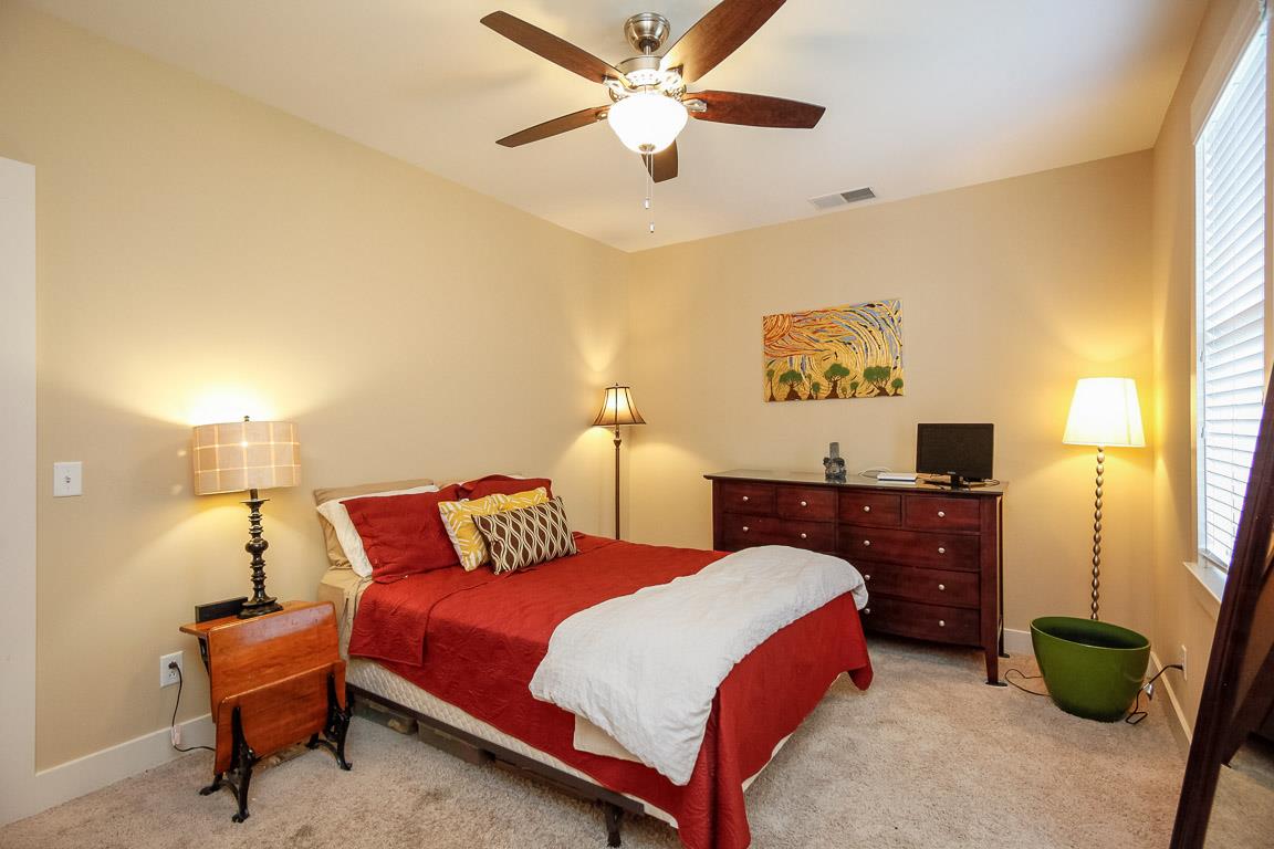 508 Madison Street, Unit 2 Nashville, TN 37208 - Photo 17 of 25 a bedroom with bed and a chandelier
