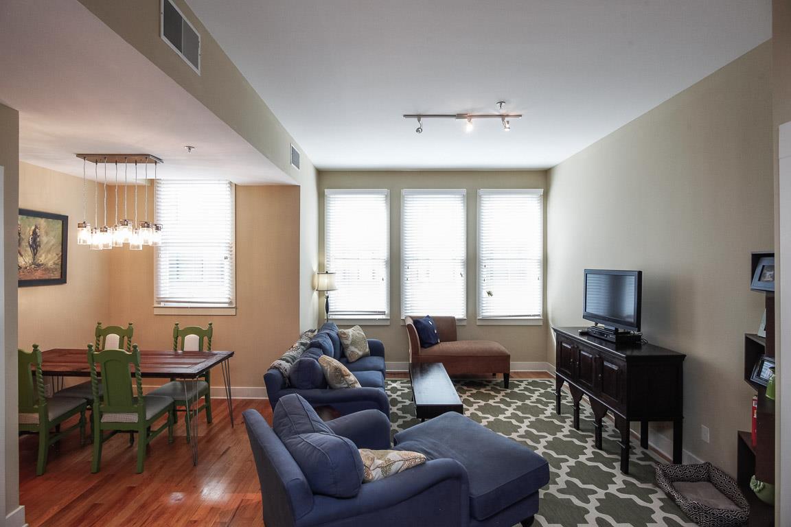 508 Madison Street, Unit 2 Nashville, TN 37208 - Photo 4 of 25 a living room with furniture a ceiling fan and a window