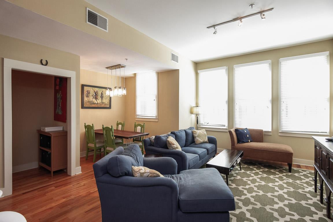 508 Madison Street, Unit 2 Nashville, TN 37208 - Photo 5 of 25 a living room with furniture and a large window