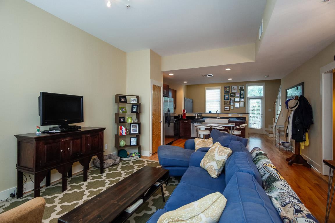 508 Madison Street, Unit 2 Nashville, TN 37208 - Photo 6 of 25 a living room with furniture and a flat screen tv