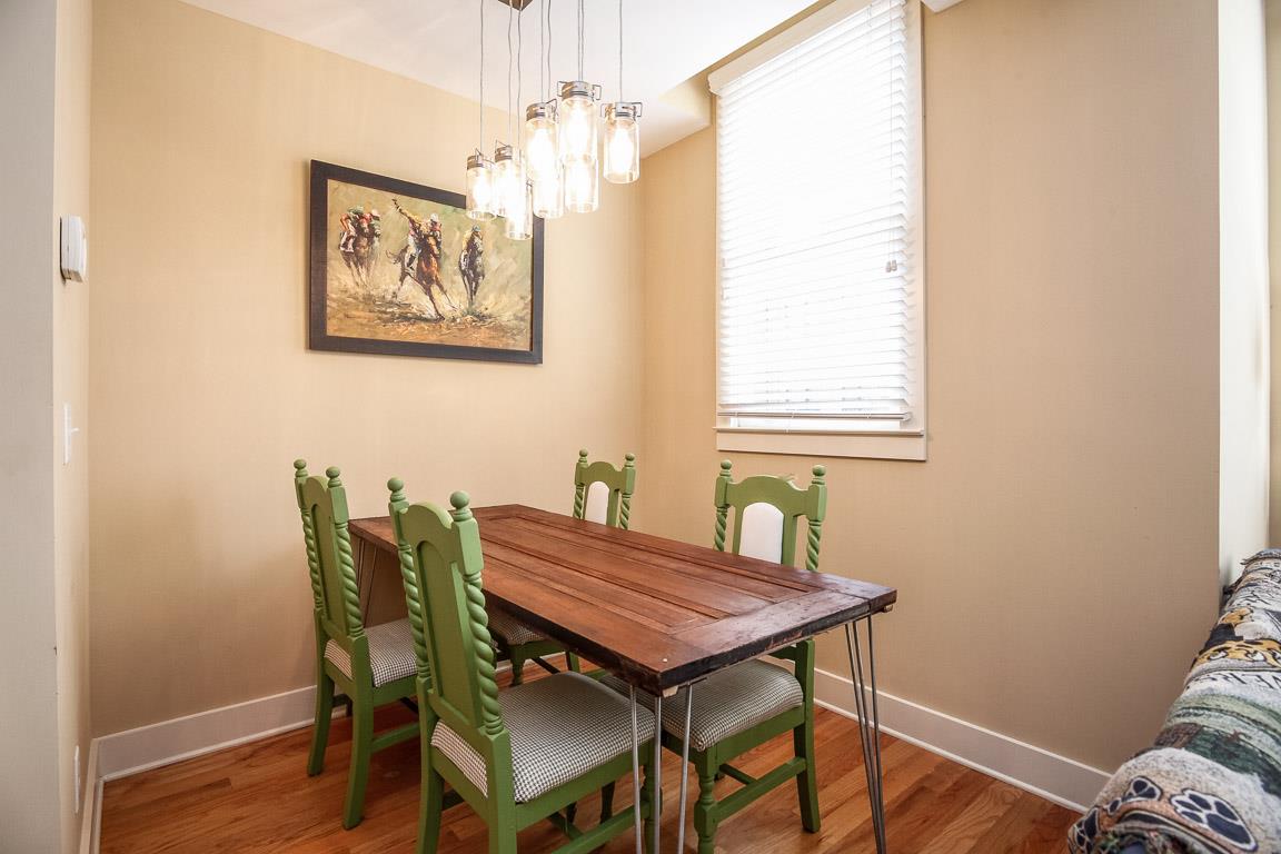 508 Madison Street, Unit 2 Nashville, TN 37208 - Photo 7 of 25 a view of a dining room with furniture and chandelier