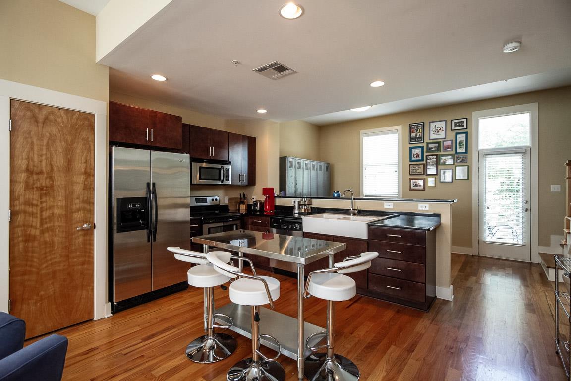 508 Madison Street, Unit 2 Nashville, TN 37208 - Photo 8 of 25 a view of a dining room with furniture window and wooden floor