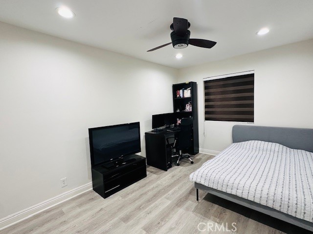 4969 Embassy Way, Unit 6 Cypress, CA 90630 - Photo 13 of 19 a bedroom with a bed and a flat screen tv