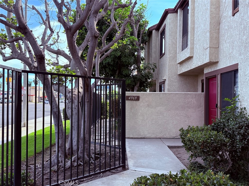 4969 Embassy Way, Unit 6 Cypress, CA 90630 - Photo 16 of 19 a view of a entrance gate of the house
