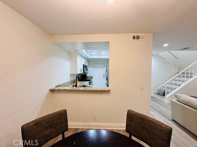 4969 Embassy Way, Unit 6 Cypress, CA 90630 - Photo 6 of 19 a room with a desk and chair