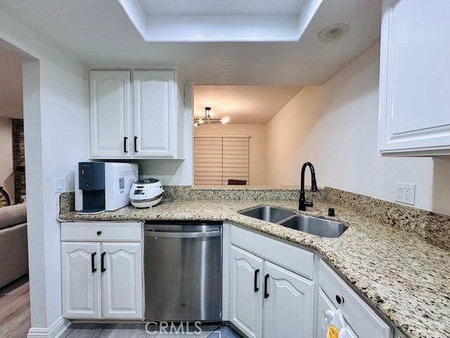 4969 Embassy Way, Unit 6 Cypress, CA 90630 - Photo 7 of 19 a kitchen with granite countertop a sink a stove and cabinets