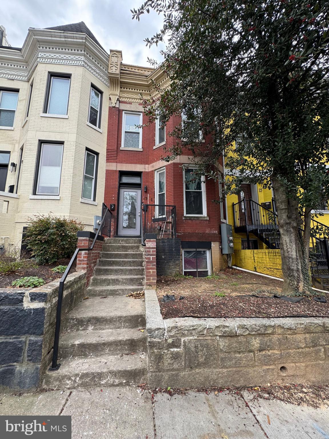 17 Rhode Island Avenue Northeast Washington, DC 20002 - Photo 1 of 12 a front view of a house with lots of trees