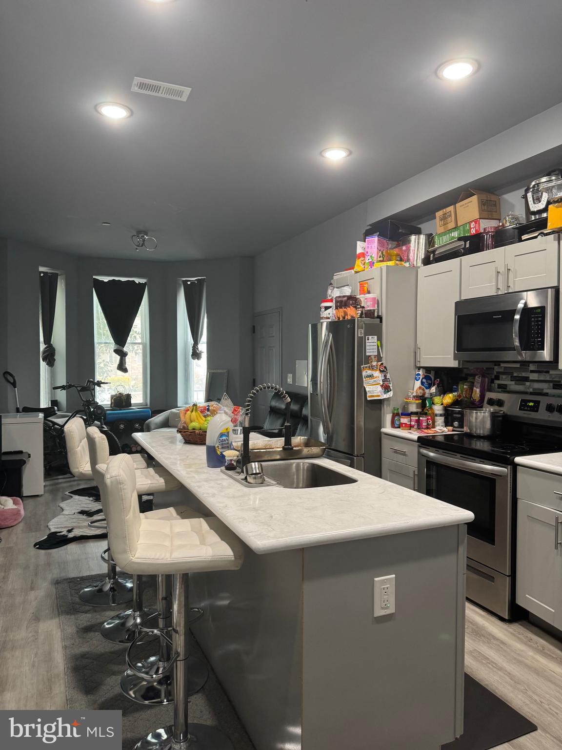 17 Rhode Island Avenue Northeast Washington, DC 20002 - Photo 2 of 12 a room with stainless steel appliances kitchen island granite countertop a stove and a sink