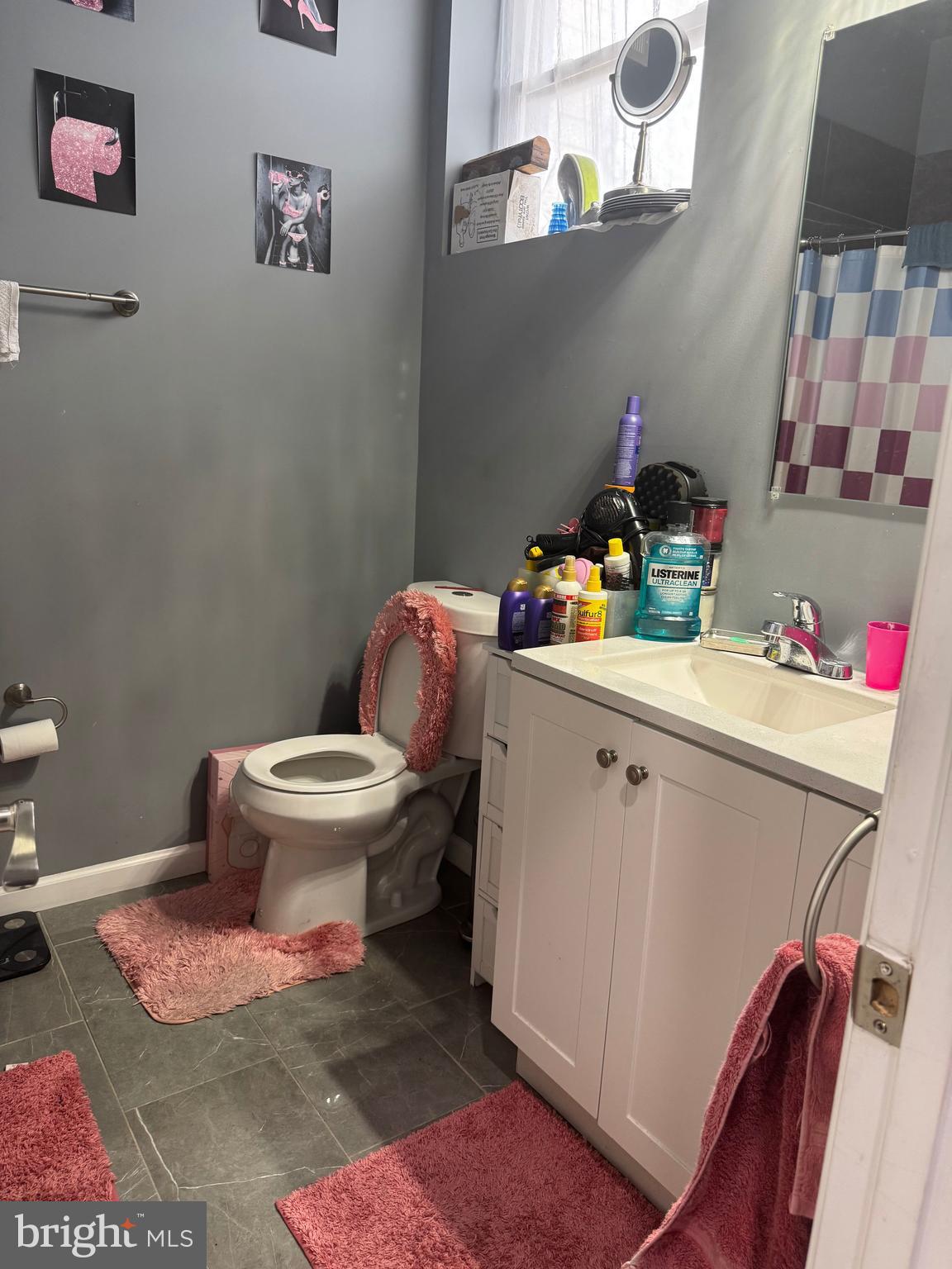 17 Rhode Island Avenue Northeast Washington, DC 20002 - Photo 8 of 12 a bathroom with a sink toilet and a mirror