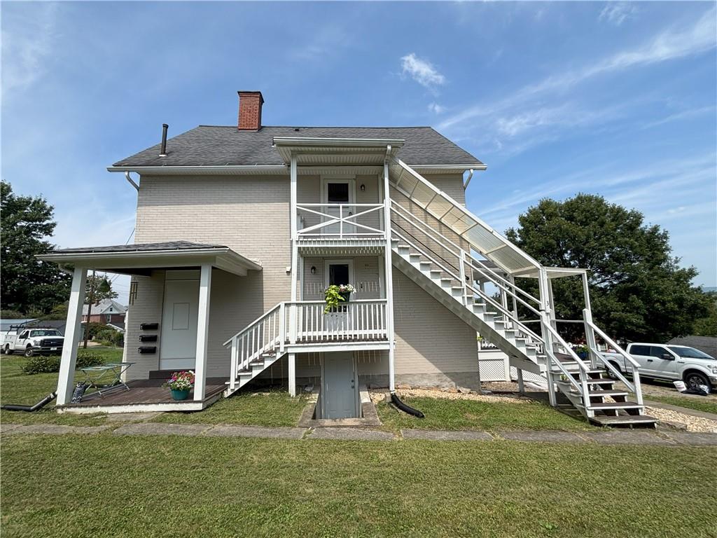 213 Franklin Street, Unit 2 Ligonier, PA 15658 - Photo 26 of 27 a view of a house with a yard
