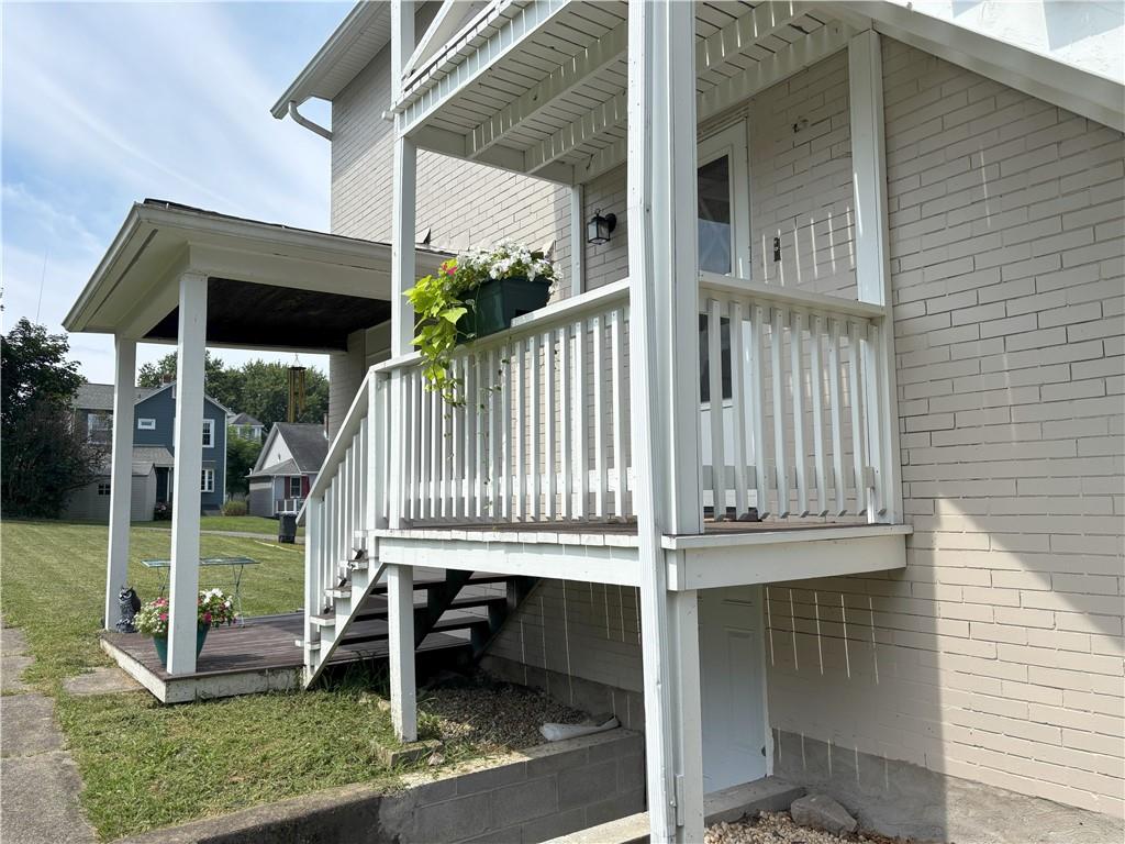 213 Franklin Street, Unit 2 Ligonier, PA 15658 - Photo 27 of 27 a balcony with a table and chairs