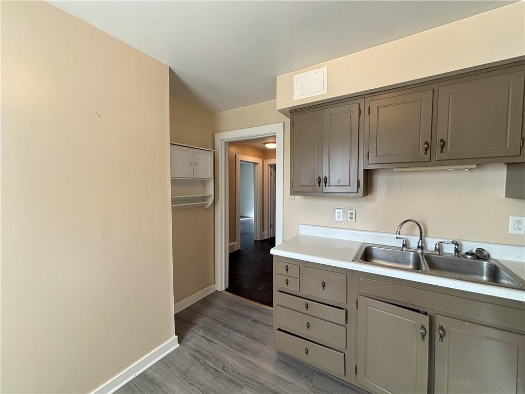 213 Franklin Street, Unit 2 Ligonier, PA 15658 - Photo 7 of 27 a kitchen with cabinets stainless steel appliances and sink