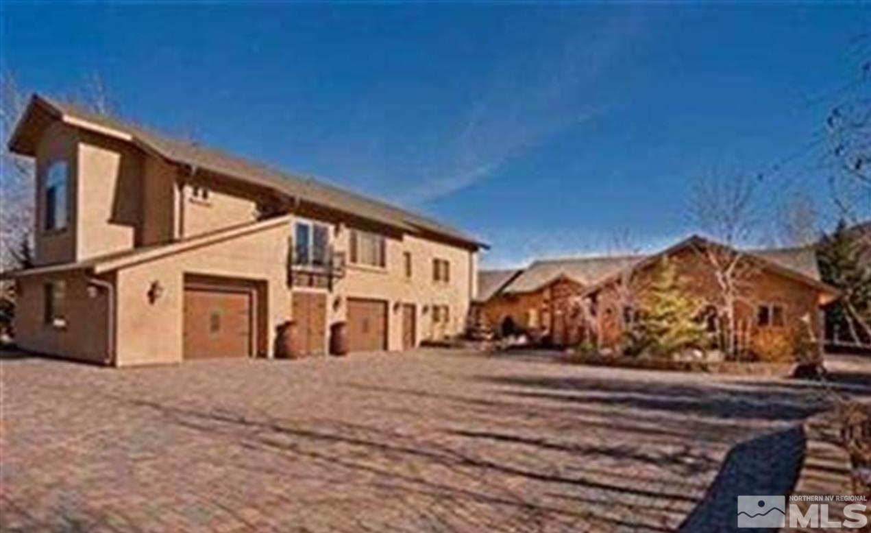 22840 Carriage Drive Reno, NV 89521 - Photo 1 of 1 a front view of a house with a yard