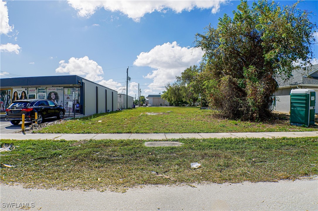 1928 Jefferson Avenue Fort Myers, FL 33901 - Photo 1 of 3 a view of a house with a yard and a large tree