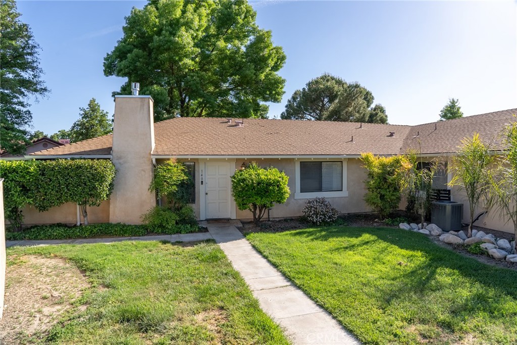 a house view with a garden space