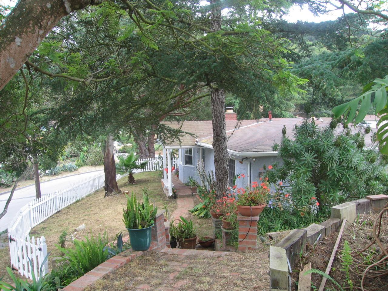 1050 Manitou Road Santa Barbara, CA 93101 - Photo 1 of 8 a front view of a house with garden