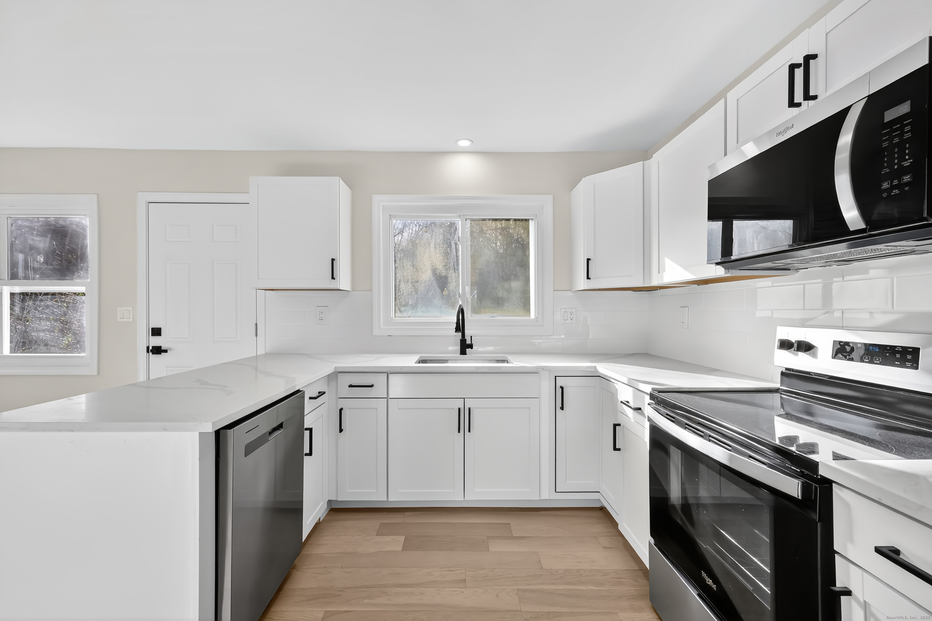2064 Long Hill Road Guilford, CT 06437 - Photo 11 of 28 a kitchen with a sink stove and microwave