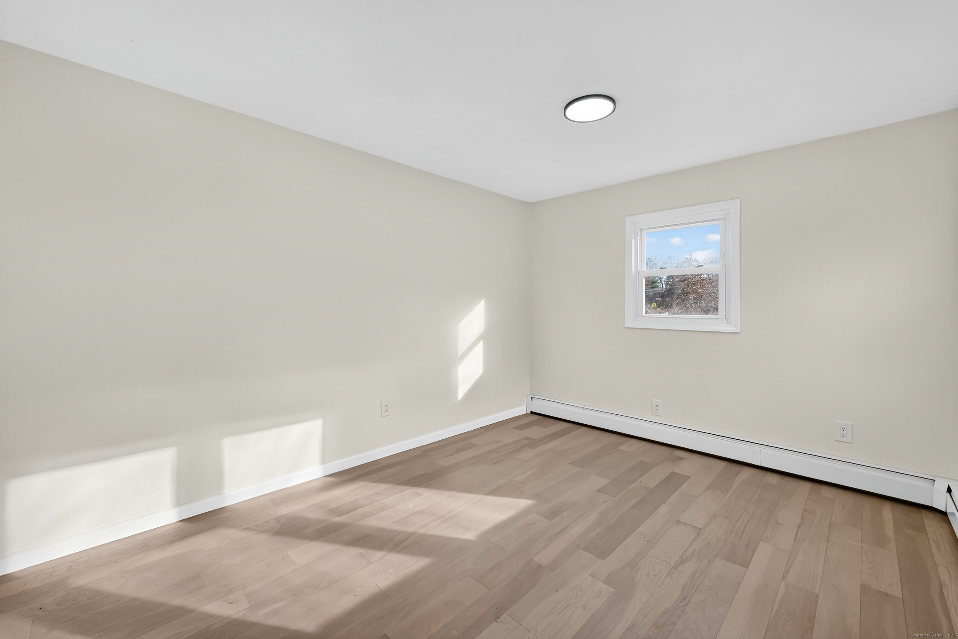 2064 Long Hill Road Guilford, CT 06437 - Photo 15 of 28 a view of an empty room with a window