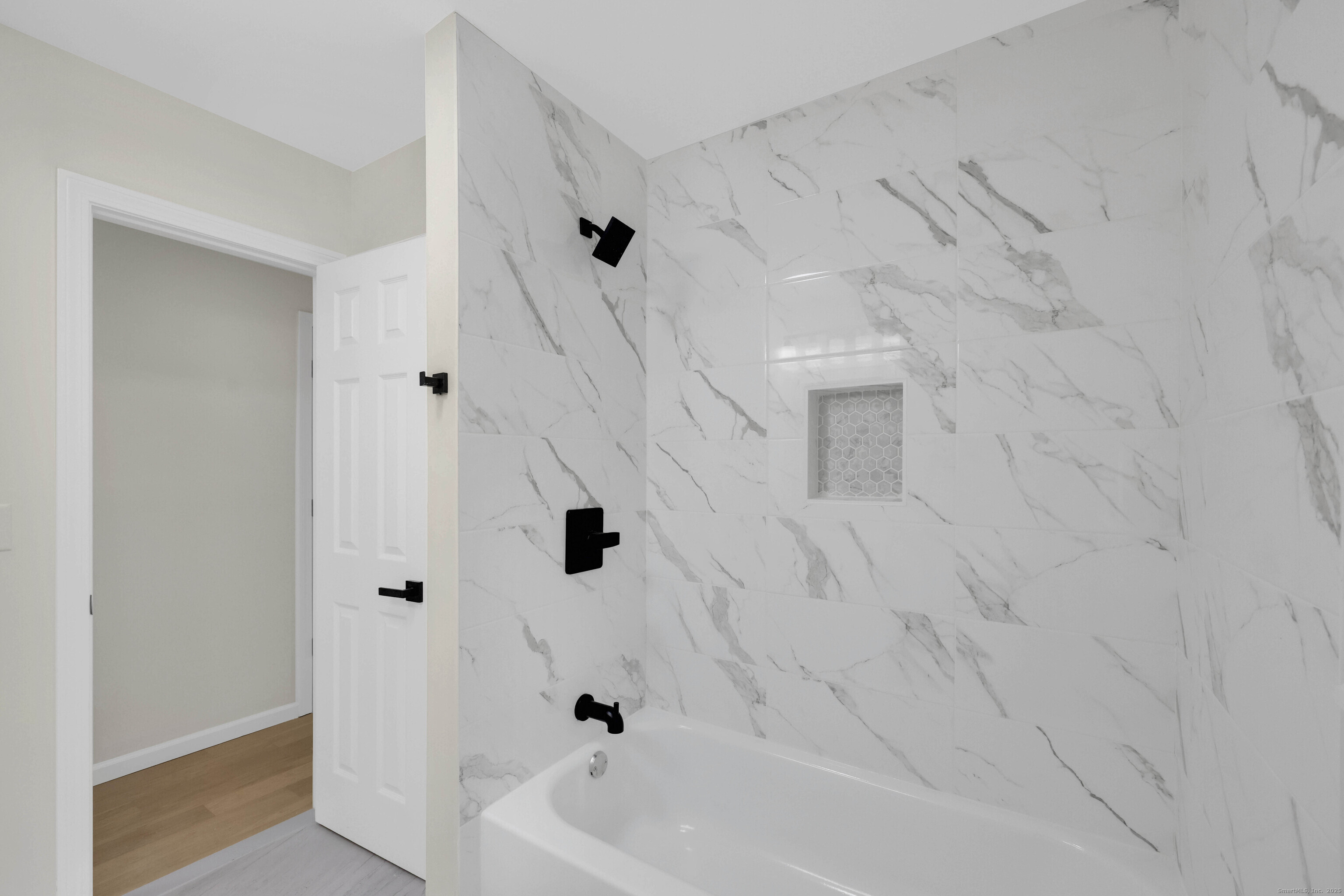 2064 Long Hill Road Guilford, CT 06437 - Photo 16 of 28 a bathroom with a bathtub and a shower