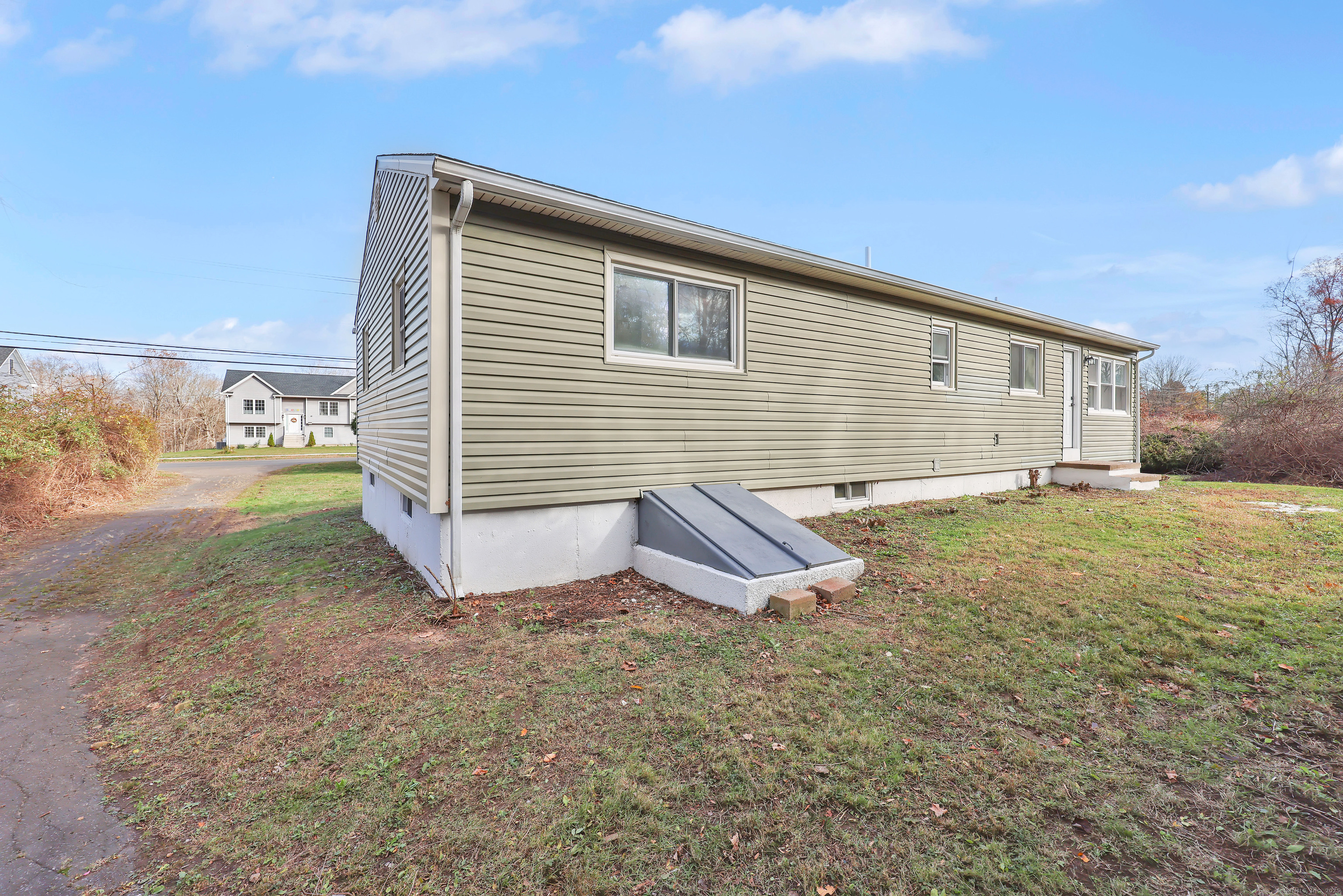 2064 Long Hill Road Guilford, CT 06437 - Photo 25 of 28 a view of a backyard with a garden
