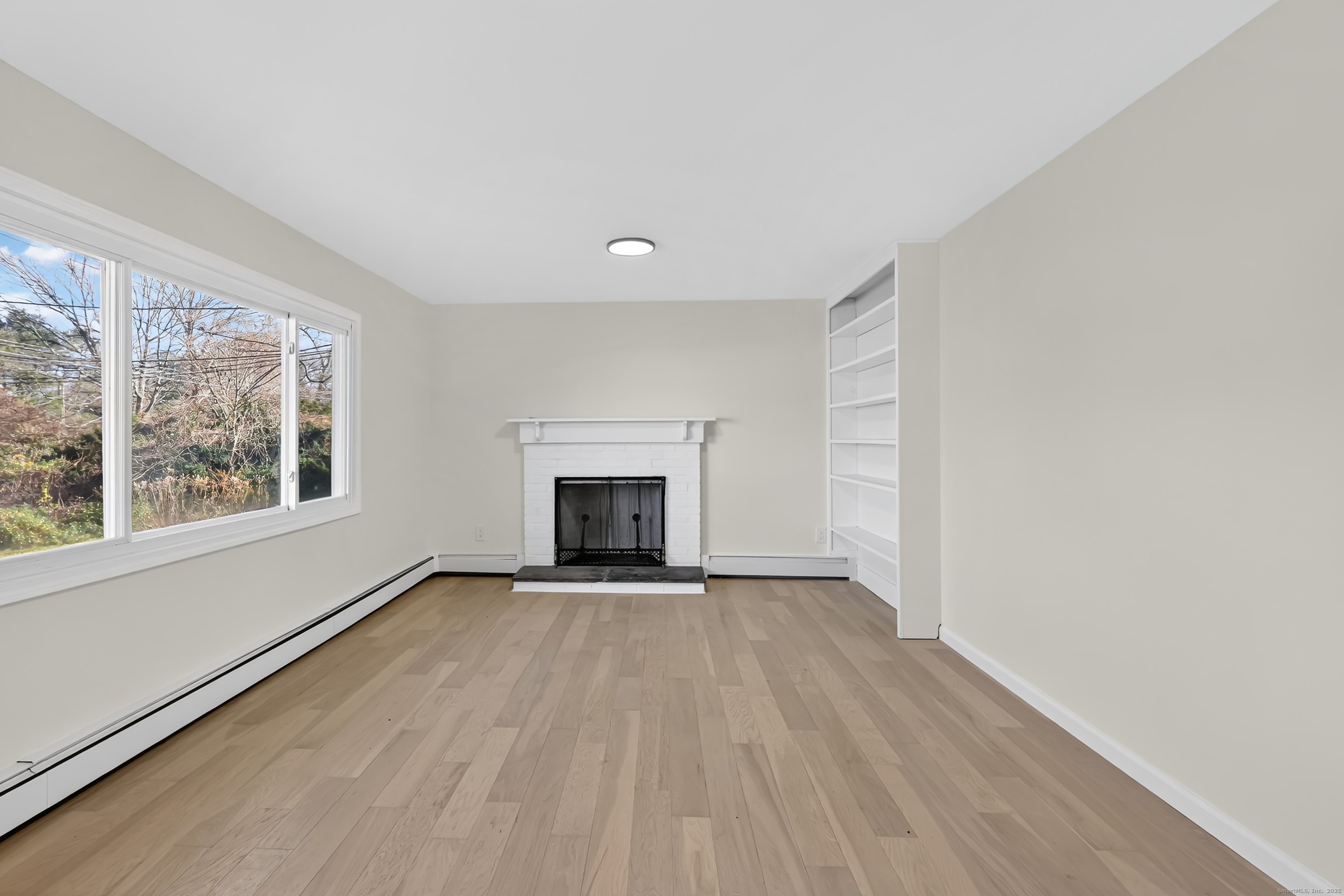 2064 Long Hill Road Guilford, CT 06437 - Photo 8 of 28 an empty room with windows